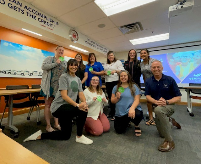Amy Bayer and Bill Bunzel visited with employees at Holiday Automotive and presented GREEN DOT training.